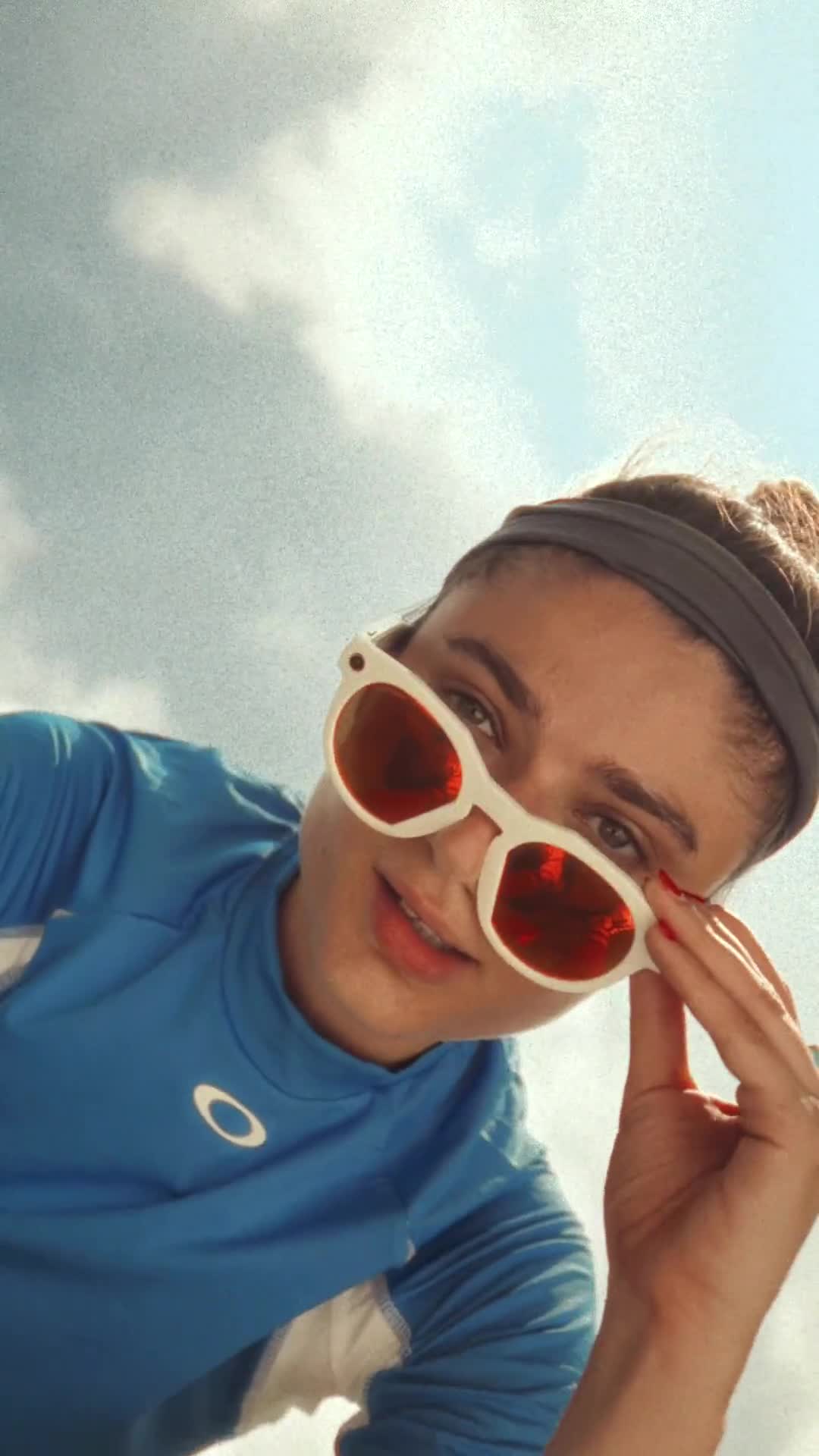 Person looking over sunglasses at camera